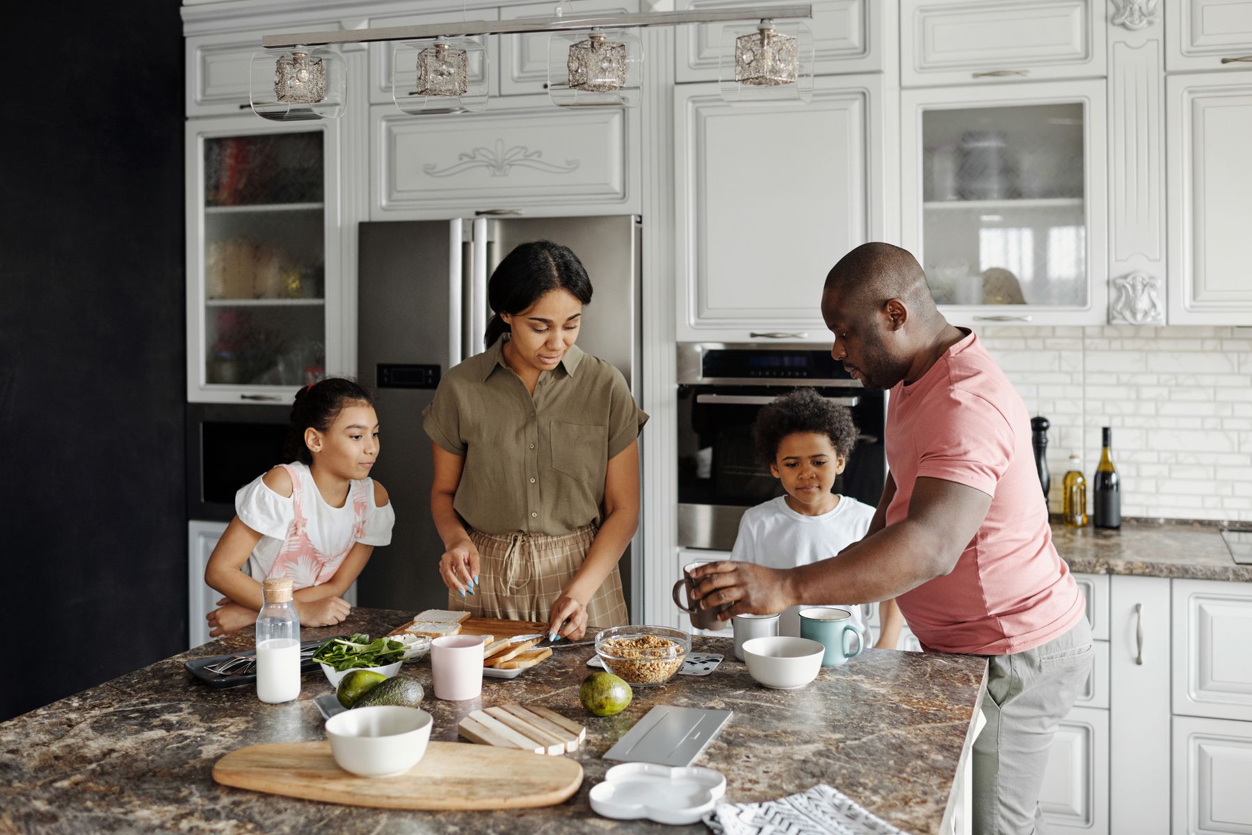 A family preparing food together in a kitchen